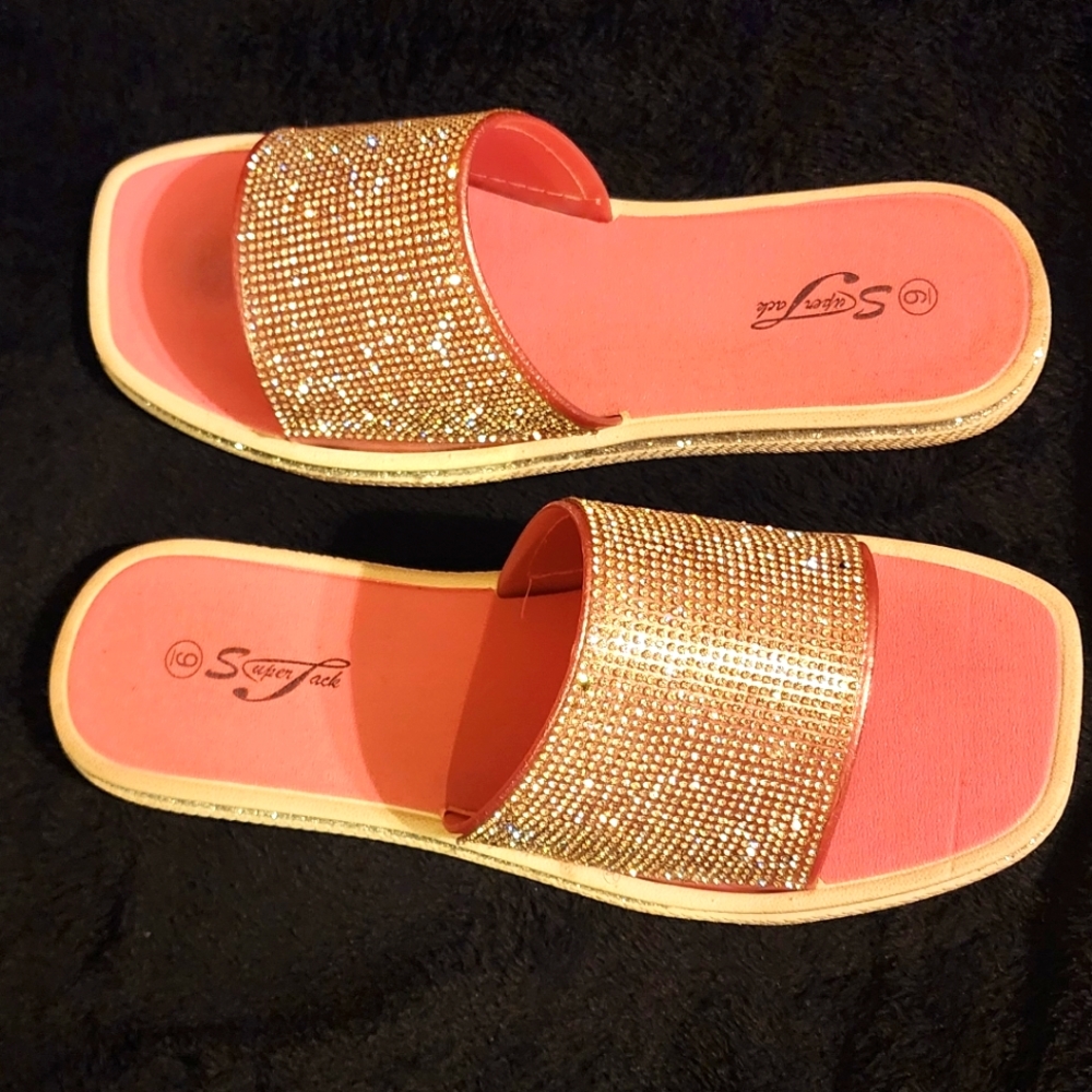 A pair of women's slides with rhinestones.